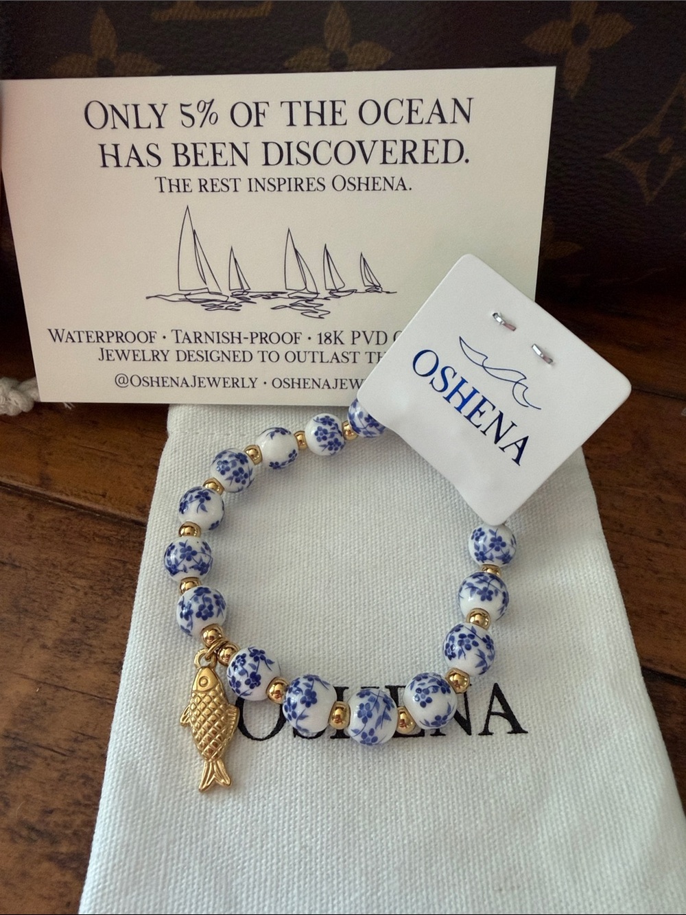Oshena Blue & White Floral‎ Bead Bracelet with Gold Fish Charm